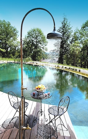 Outdoor pool, a natural pool, sun loungers