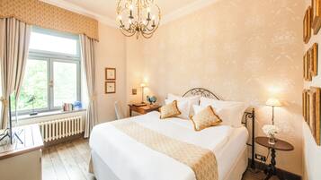 Superior Room | Minibar, in-room safe, desk, iron/ironing board