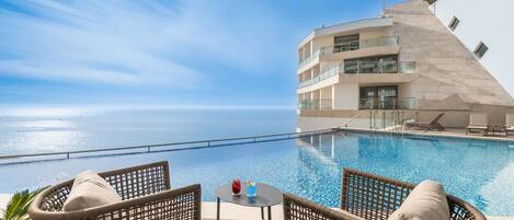 Indoor pool, outdoor pool, pool umbrellas, sun loungers