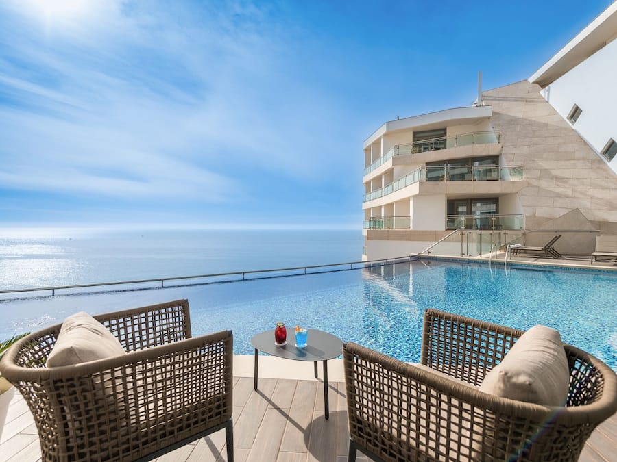 Indoor pool, outdoor pool, pool umbrellas, pool loungers