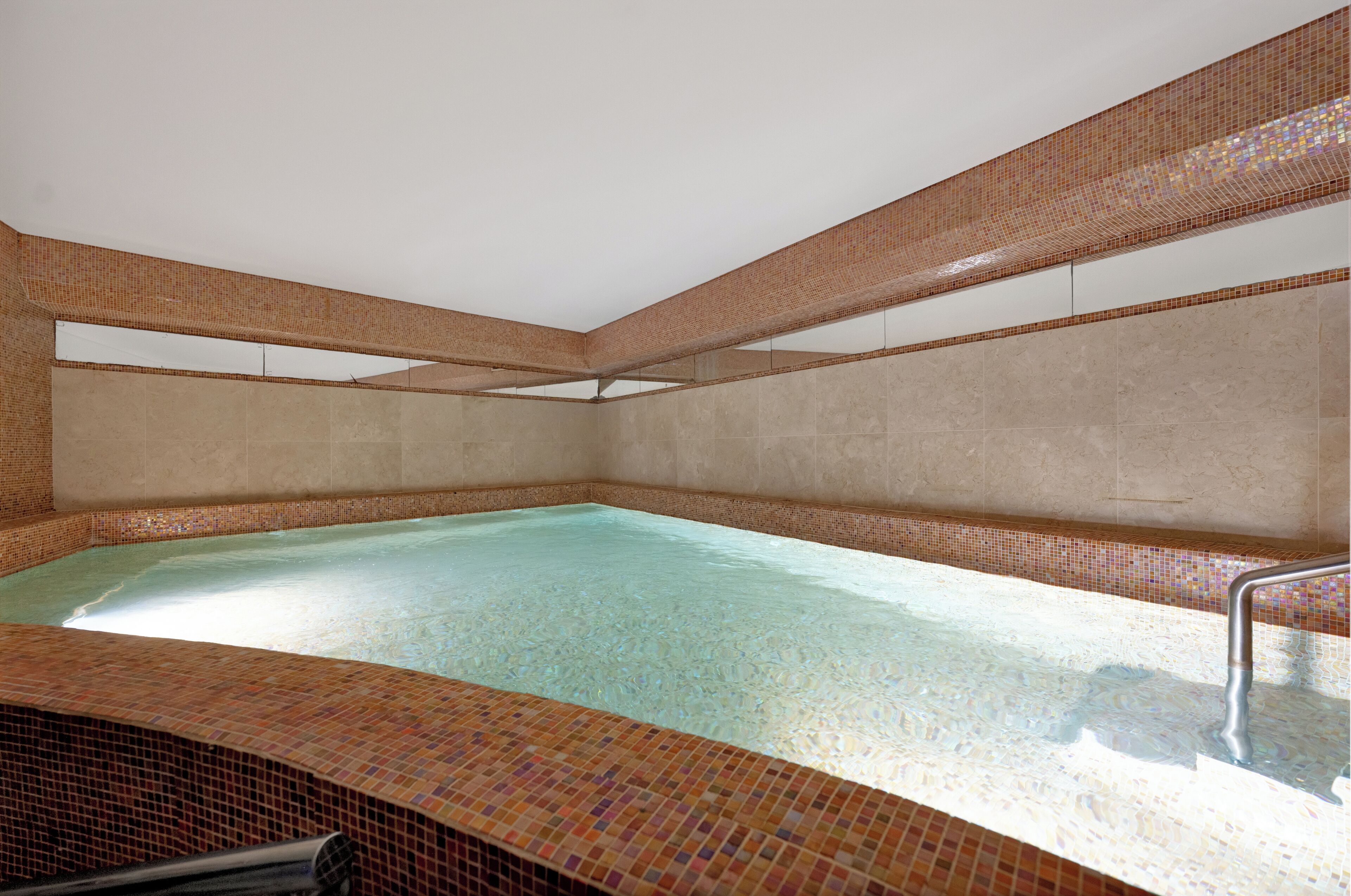 indoor pool, outdoor pool, pool umbrellas, pool loungers