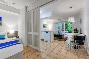Deluxe Apartment, 1 Bedroom | Living area | 43-inch Smart TV with satellite channels, TV - Port Douglas Apartments - Adults Only Oasis (Port Douglas)