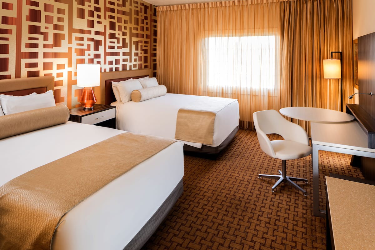 Resort Opulence Two Queens | 1 bedroom, blackout drapes, free cribs/infant beds, rollaway beds