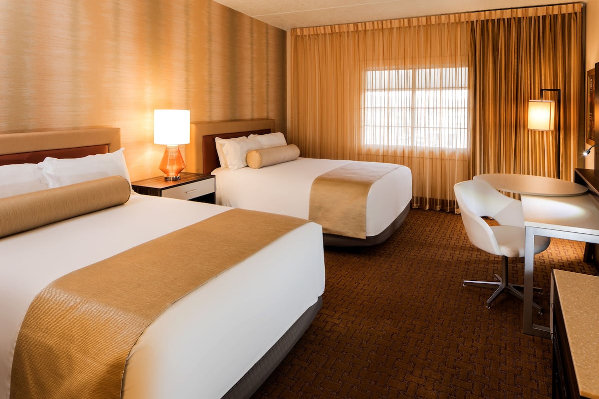 Opulence Two Queen Room | 1 bedroom, blackout drapes, free cribs/infant beds, rollaway beds