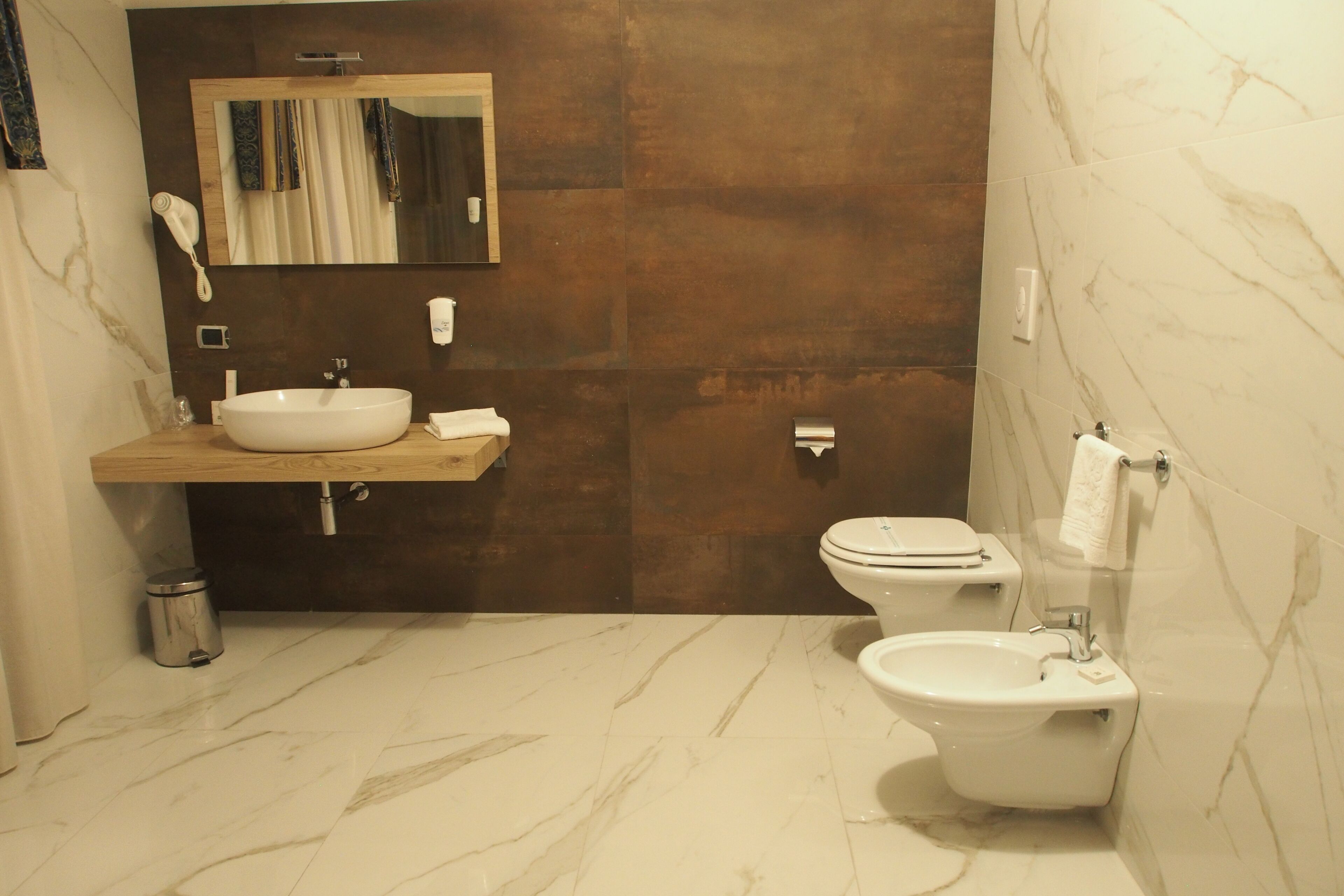 free toiletries, hair dryer, slippers, bidet