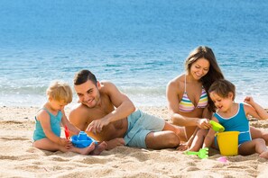 On the beach, sun loungers, beach umbrellas, beach towels