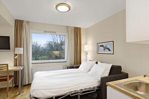 Family Room | Desk, blackout curtains, iron/ironing board, free WiFi