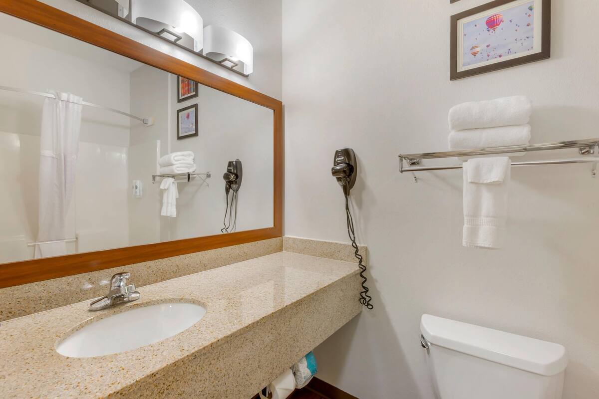 desk, laptop workspace, blackout curtains, iron/ironing board