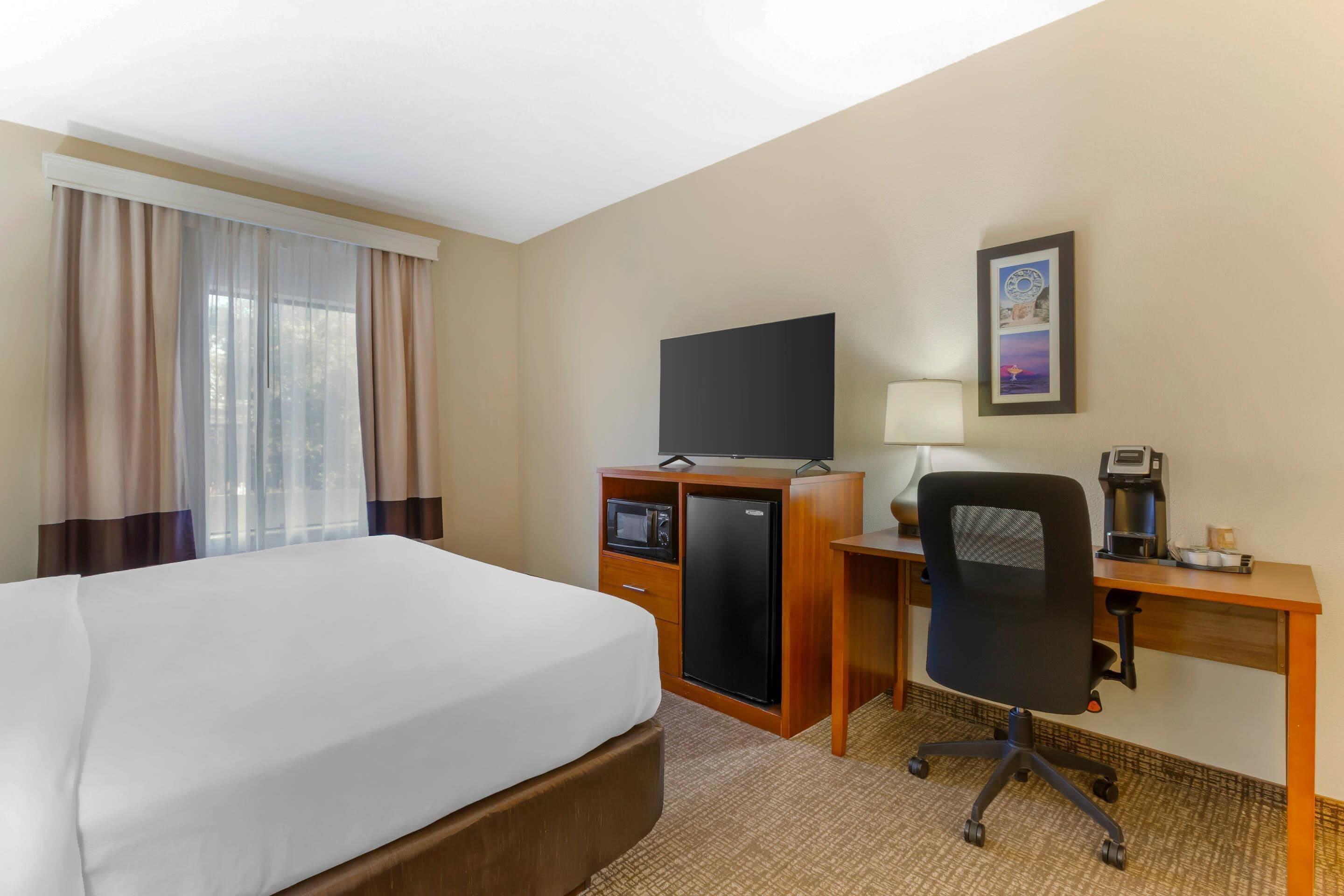 desk, laptop workspace, blackout curtains, iron/ironing board