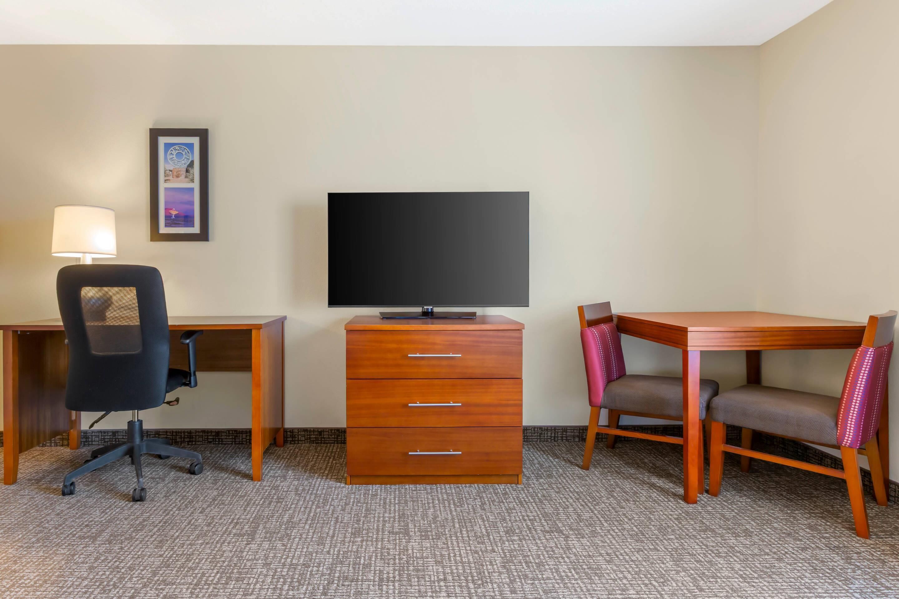 desk, laptop workspace, blackout curtains, iron/ironing board