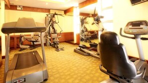 A gym with treadmills, elliptical machines, and weight equipment. - Liberty Hotel Saigon Parkview (Ho Chi Minh City)