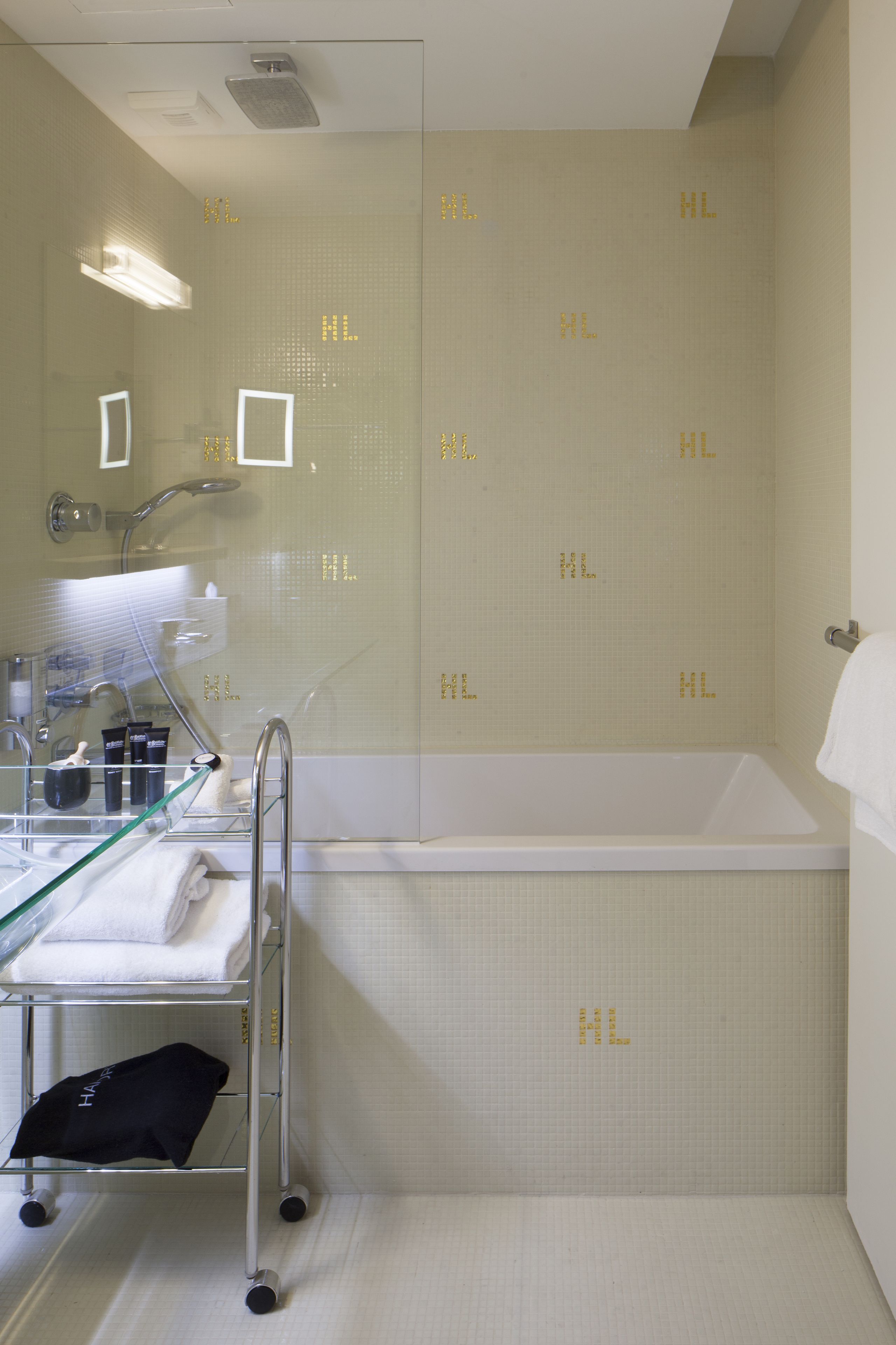 club double room | bathroom | rainfall showerhead, eco-friendly toiletries, hair dryer, bathrobes