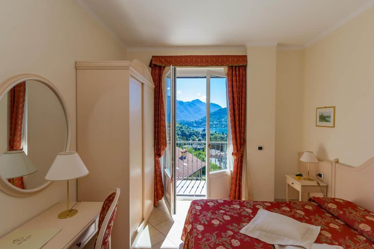 double room, lake view | down duvets, minibar, in-room safe, desk