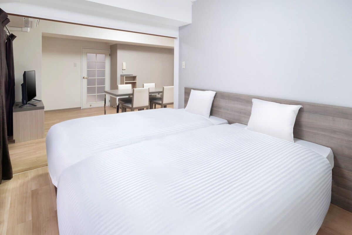 Deluxe Residential Family Room | Down comforters, blackout drapes, iron/ironing board (on request)