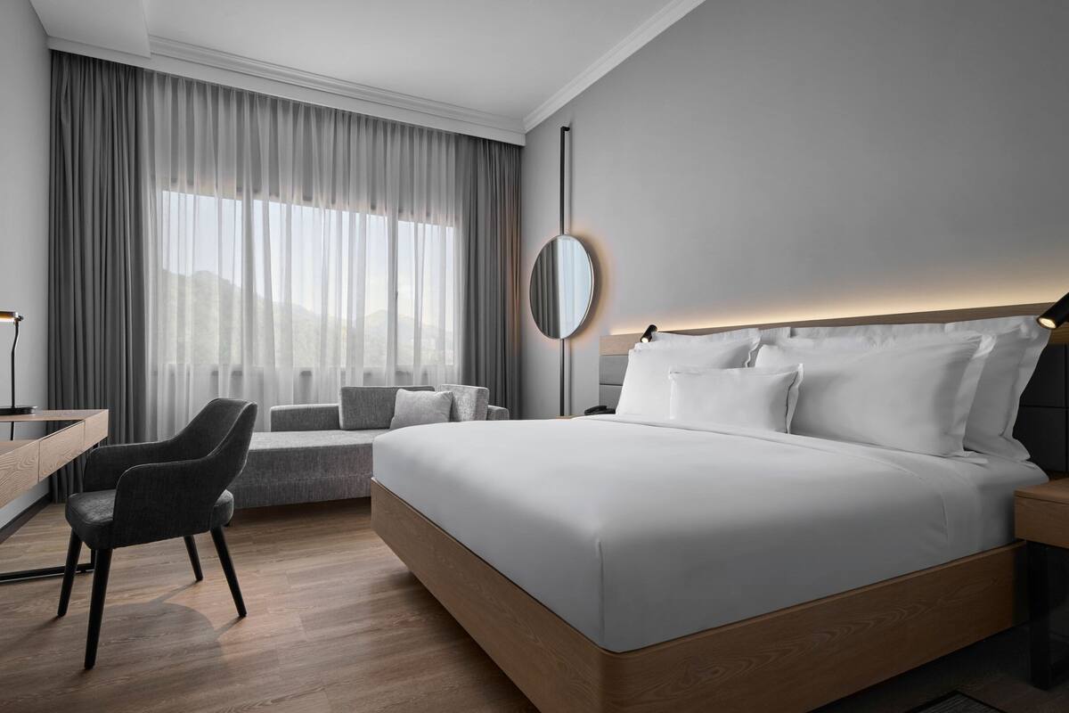 premium room, 1 king bed with sofa bed | 1 bedroom, in-room safe, desk, blackout curtains