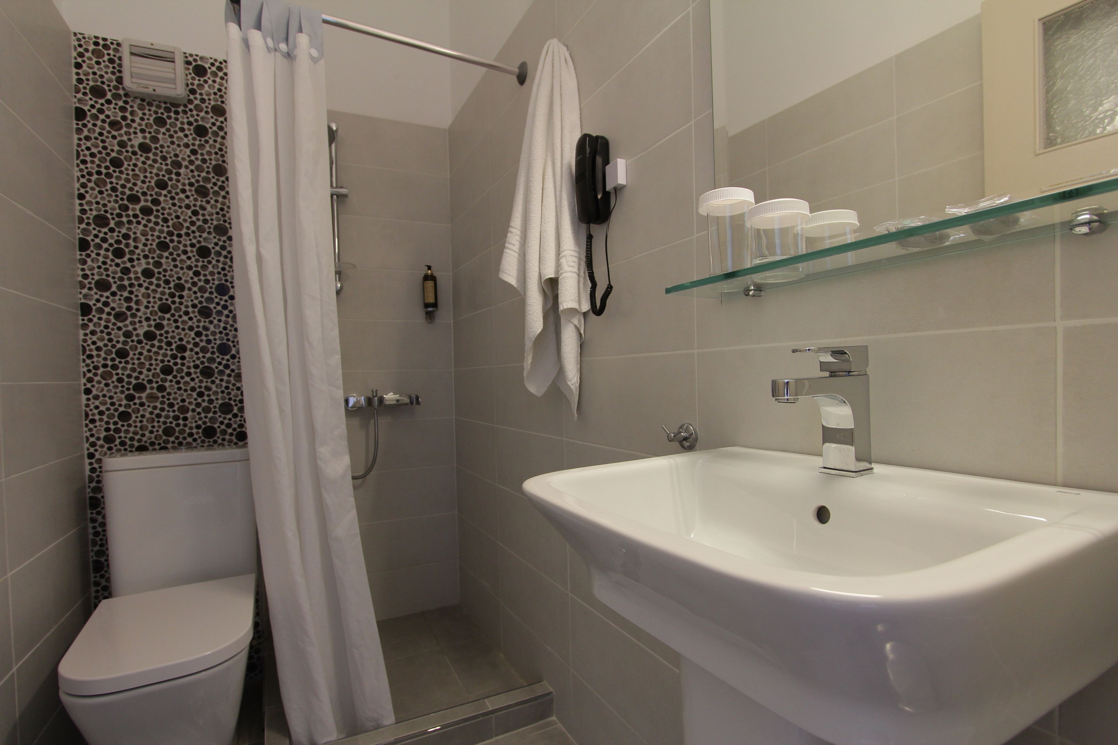 rainfall showerhead, free toiletries, hair dryer, slippers