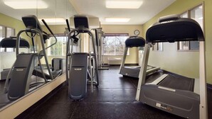 A gym with treadmills, elliptical machines, and weight equipment. - Country Inn & Suites by Radisson, Norman near University (Norman)