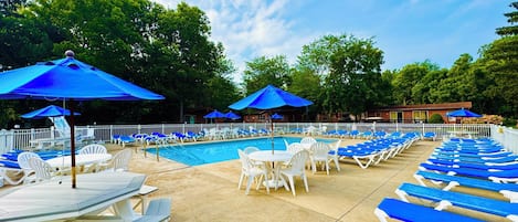 Seasonal outdoor pool, open 10:00 AM to 10:00 PM, pool umbrellas