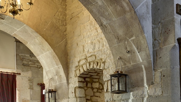 A dining area with stone walls, wooden chairs, and tables set for a meal. - Normanton Park Hotel, BW Signature Collection (Oakham)