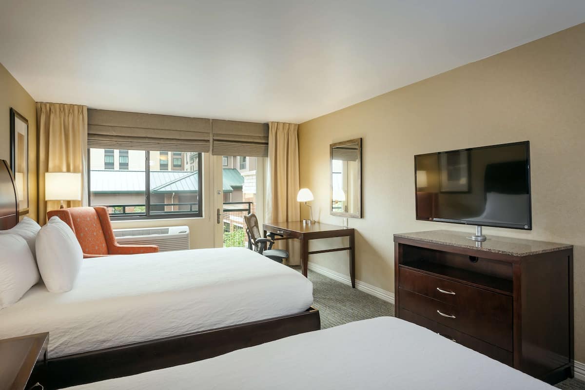 Hypo-allergenic bedding, desk, laptop workspace, blackout curtains