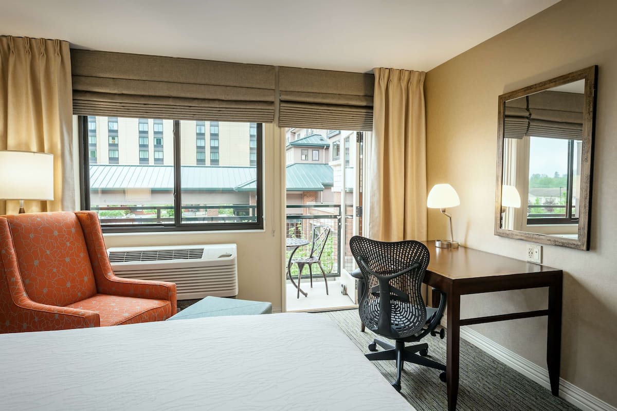 Hypo-allergenic bedding, desk, laptop workspace, blackout curtains