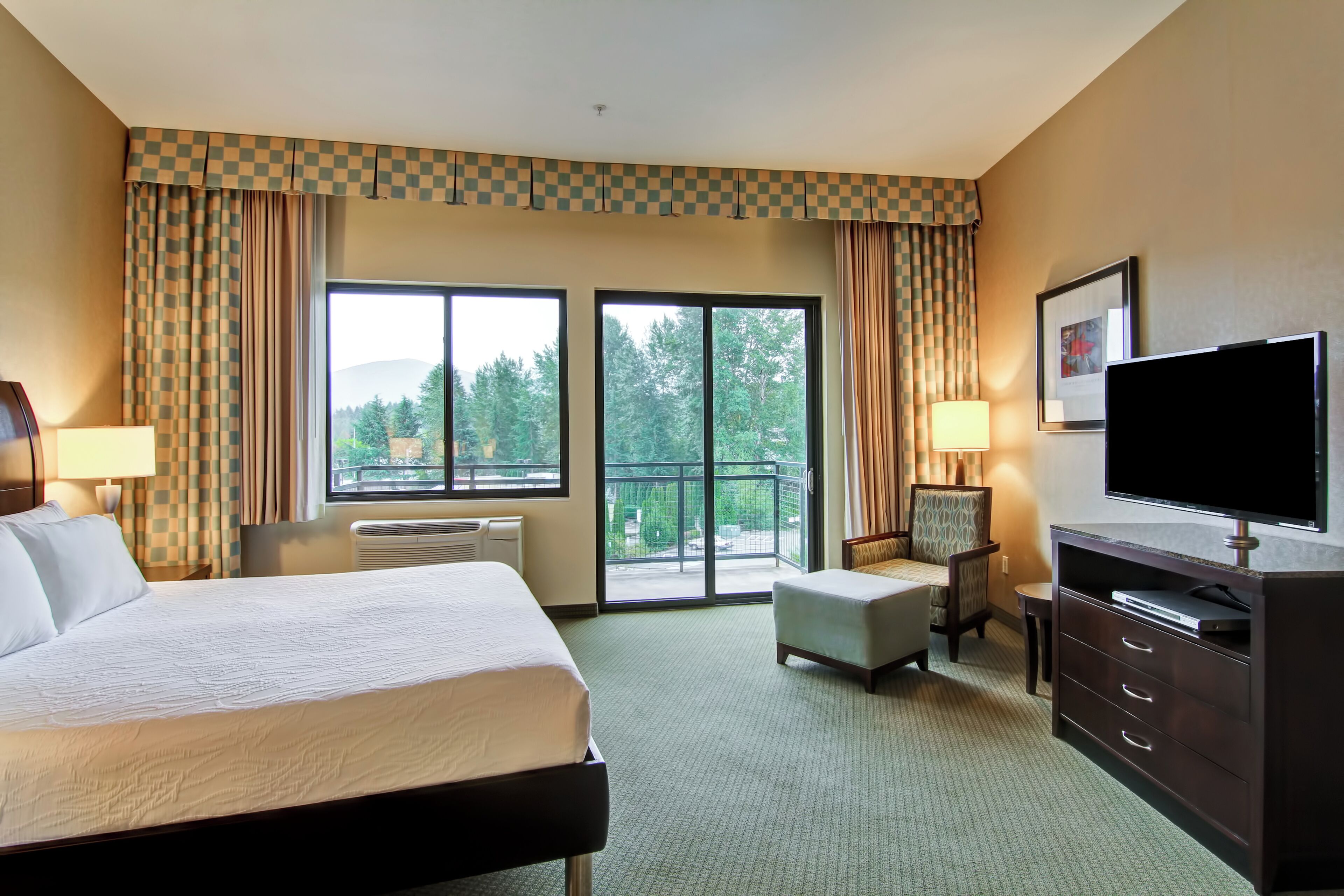 Hypo-allergenic bedding, desk, laptop workspace, blackout curtains