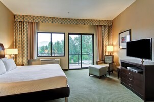 Hypo-allergenic bedding, desk, laptop workspace, blackout drapes