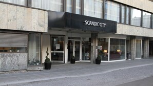 A building with a sign reading "SCANDIC CITY".