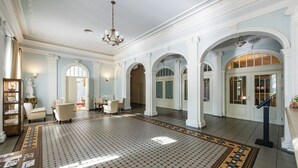 A spacious lobby with high ceilings, ornate columns, and a patterned floor. - Spa Hotel Europa Royale Druskininkai (Druskininkai)