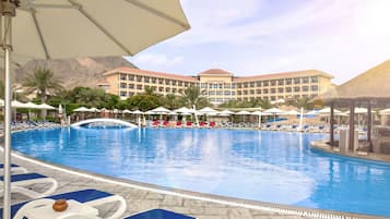 Outdoor pool, open 7:00 AM to 6:30 PM, pool umbrellas, sun loungers