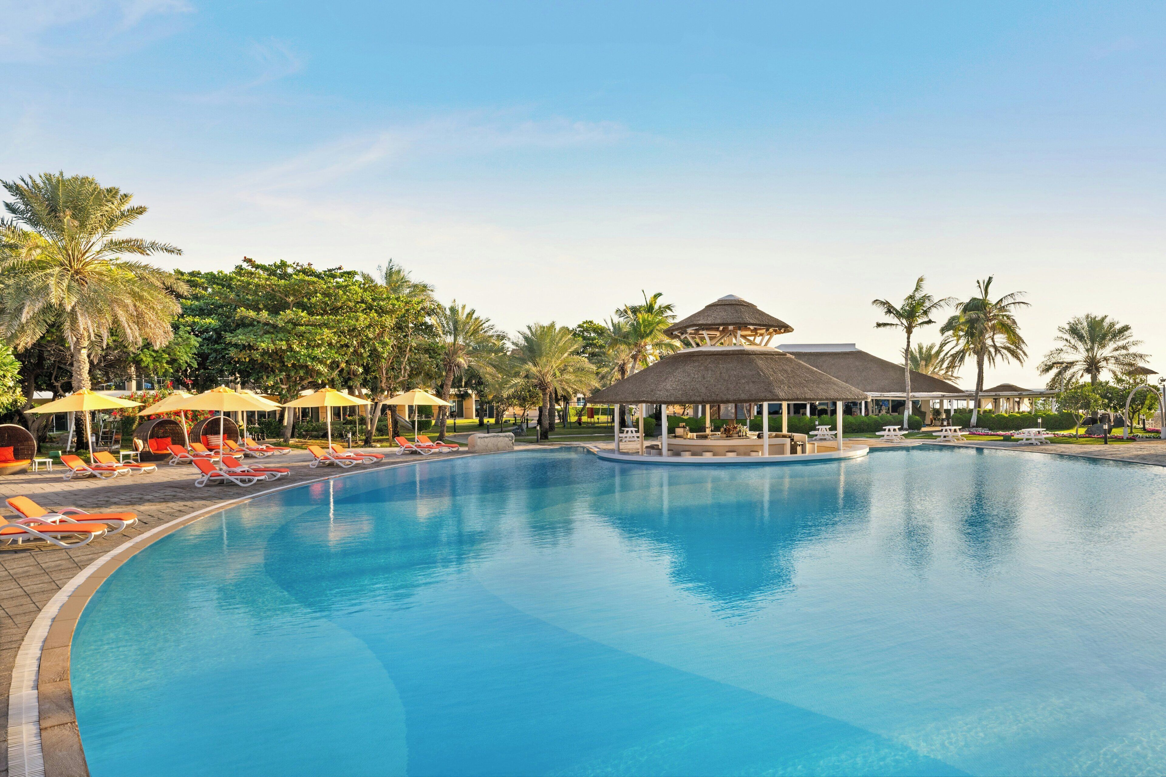 Outdoor pool, open 7:00 AM to 6:30 PM, pool umbrellas, pool loungers