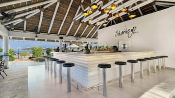 3 bars/lounges, swim-up bar, poolside bar, beach bar