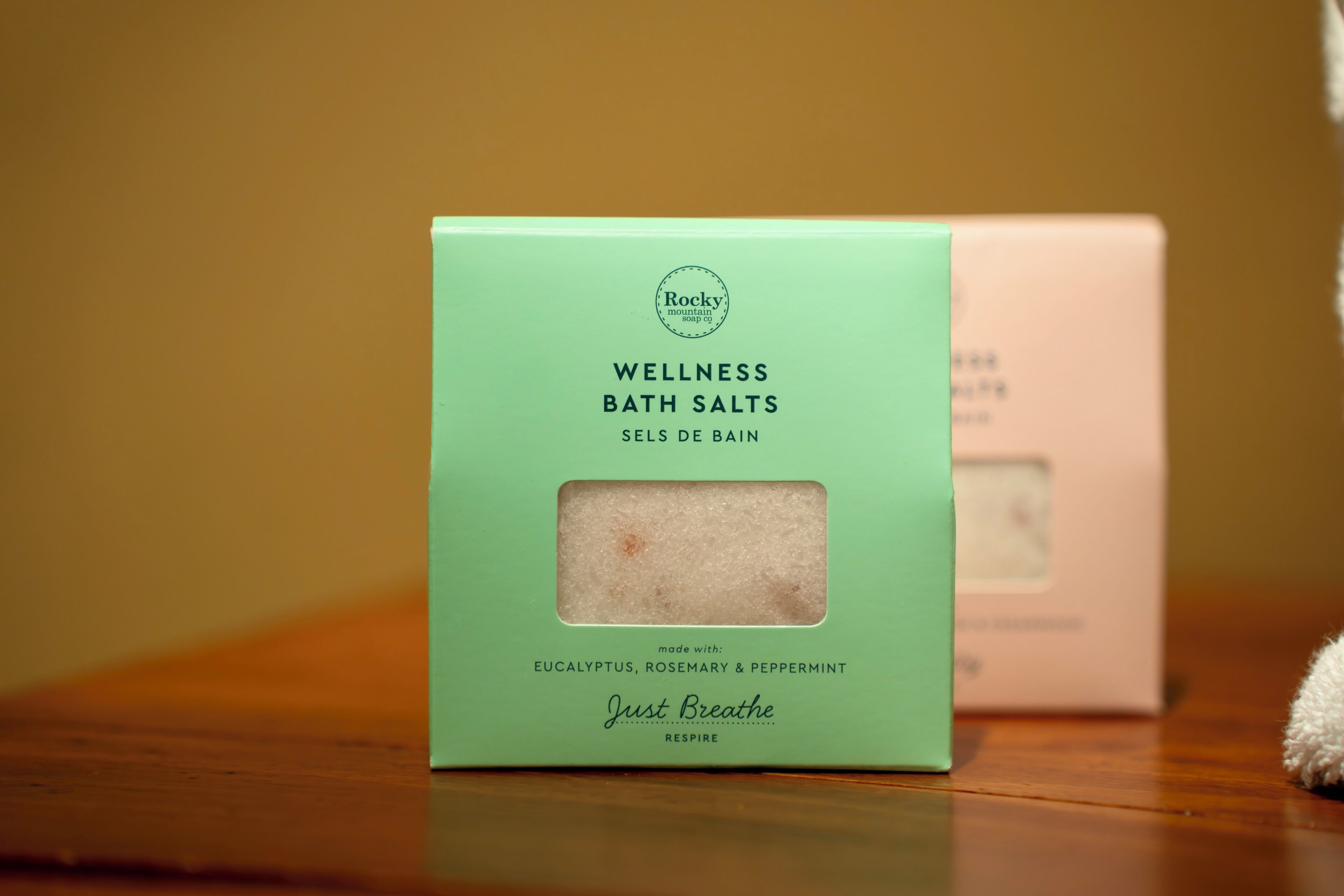 A box of wellness bath salts with eucalyptus, rosemary, and peppermint.