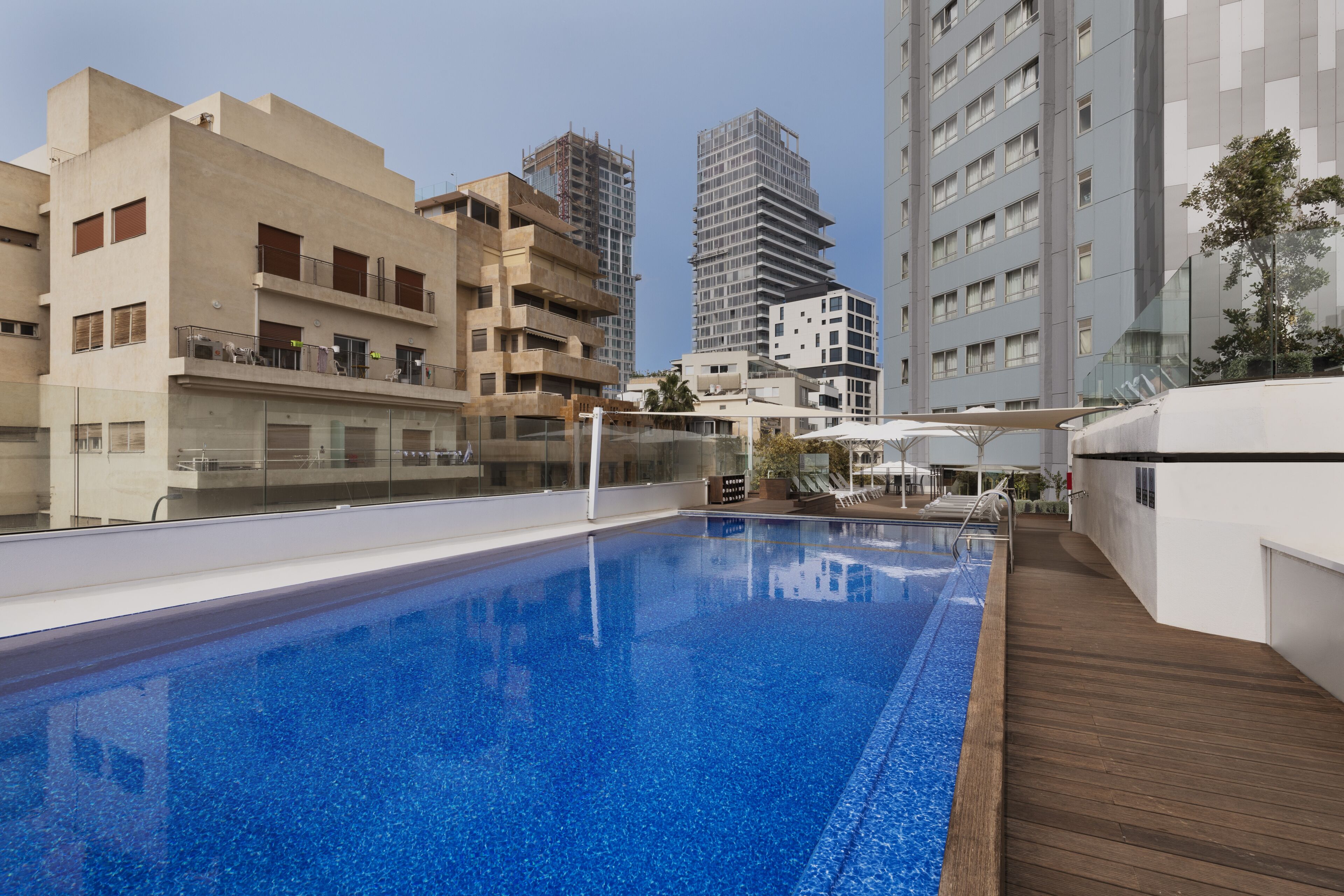 Seasonal outdoor pool, open 10 AM to 6 PM, pool umbrellas, sun loungers