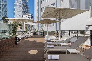 Seasonal outdoor pool, open 10 AM to 6 PM, pool umbrellas, sun loungers