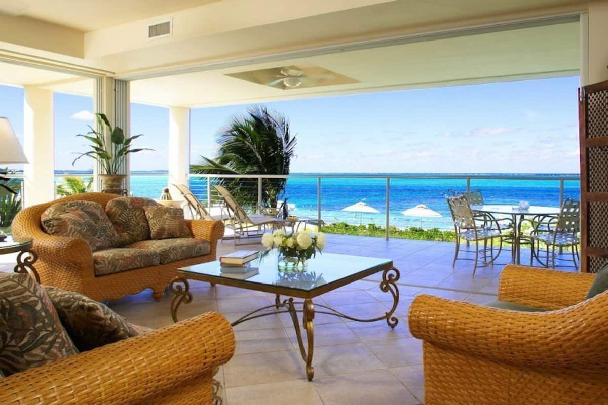 2-Bedroom Oceanfront (1202) | Living area | 50-inch flat-screen TV with cable channels, TV