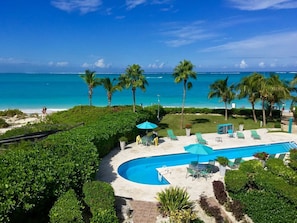On the beach, white sand, sun loungers, beach umbrellas
