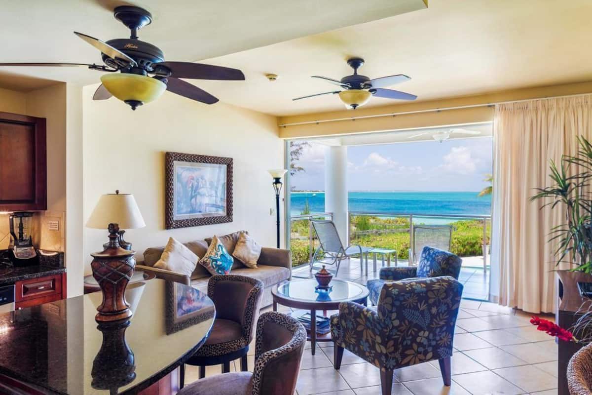 1-Bedroom Oceanfront (4202) | Living room | 50-inch flat-screen TV with cable channels, TV