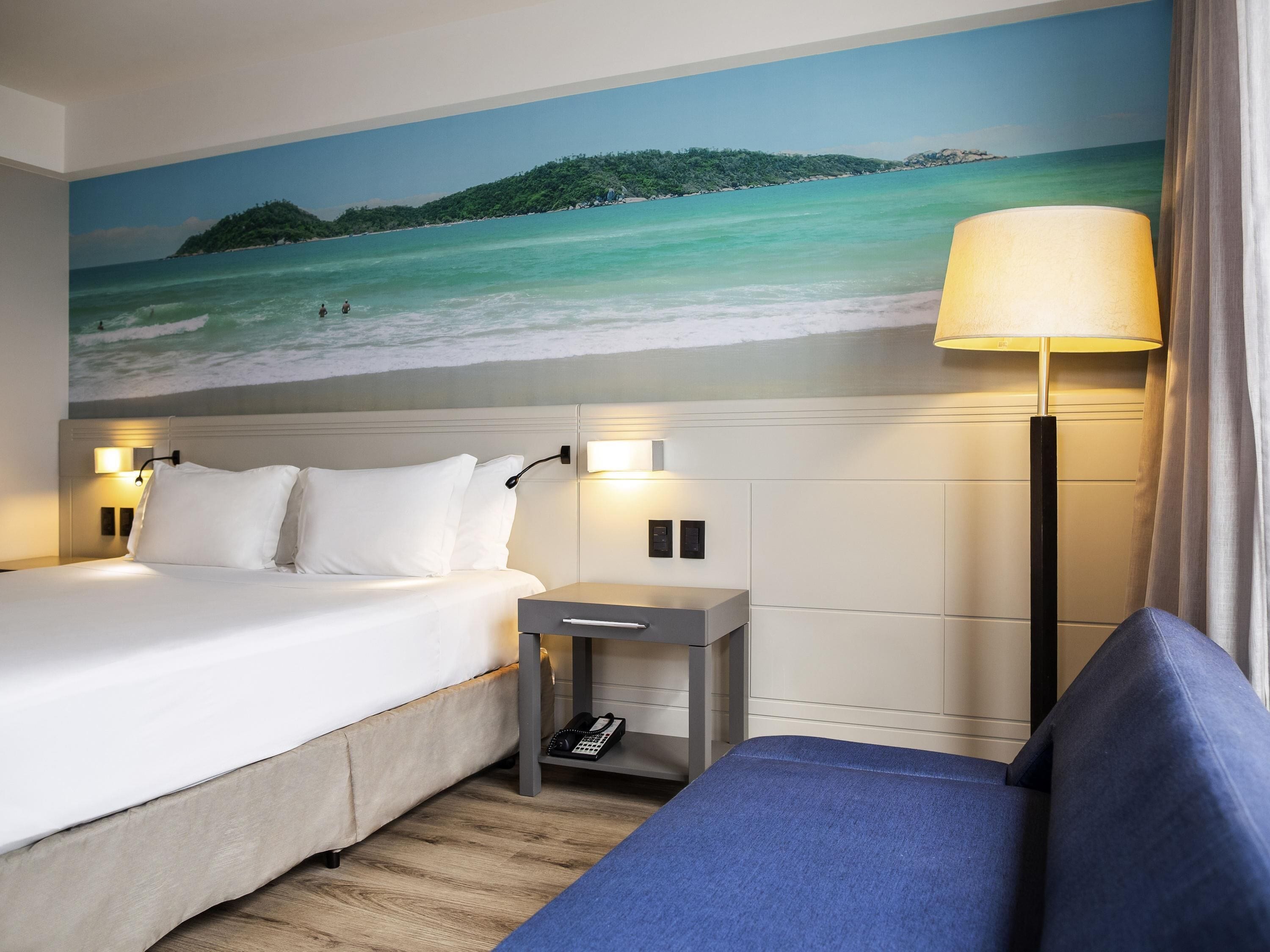 superior room, 1 king bed with sofa bed, partial sea view | minibar, in-room safe, desk, blackout curtains