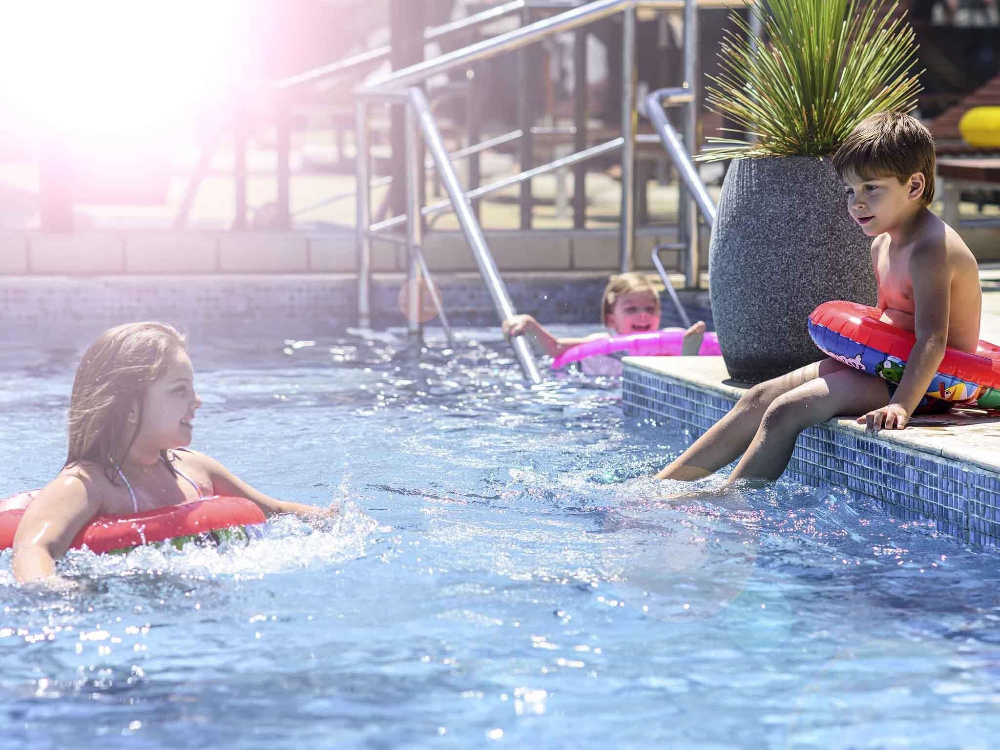 Outdoor pool, open 8:00 AM to 9:00 PM, pool umbrellas, sun loungers