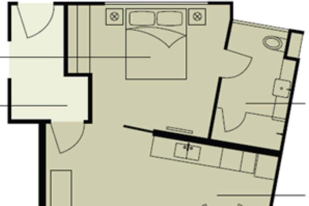 Un plan d’étage comprenant un salon, un coin repas, une cuisine et deux chambres.