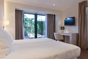 Standard Double or Twin Room | Minibar, in-room safe, desk, blackout drapes