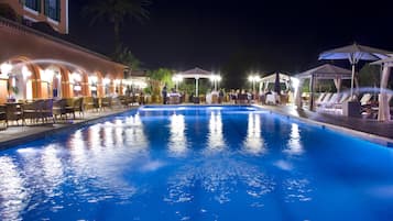 Outdoor pool, open 10:00 AM to 9:00 PM, pool umbrellas, pool loungers