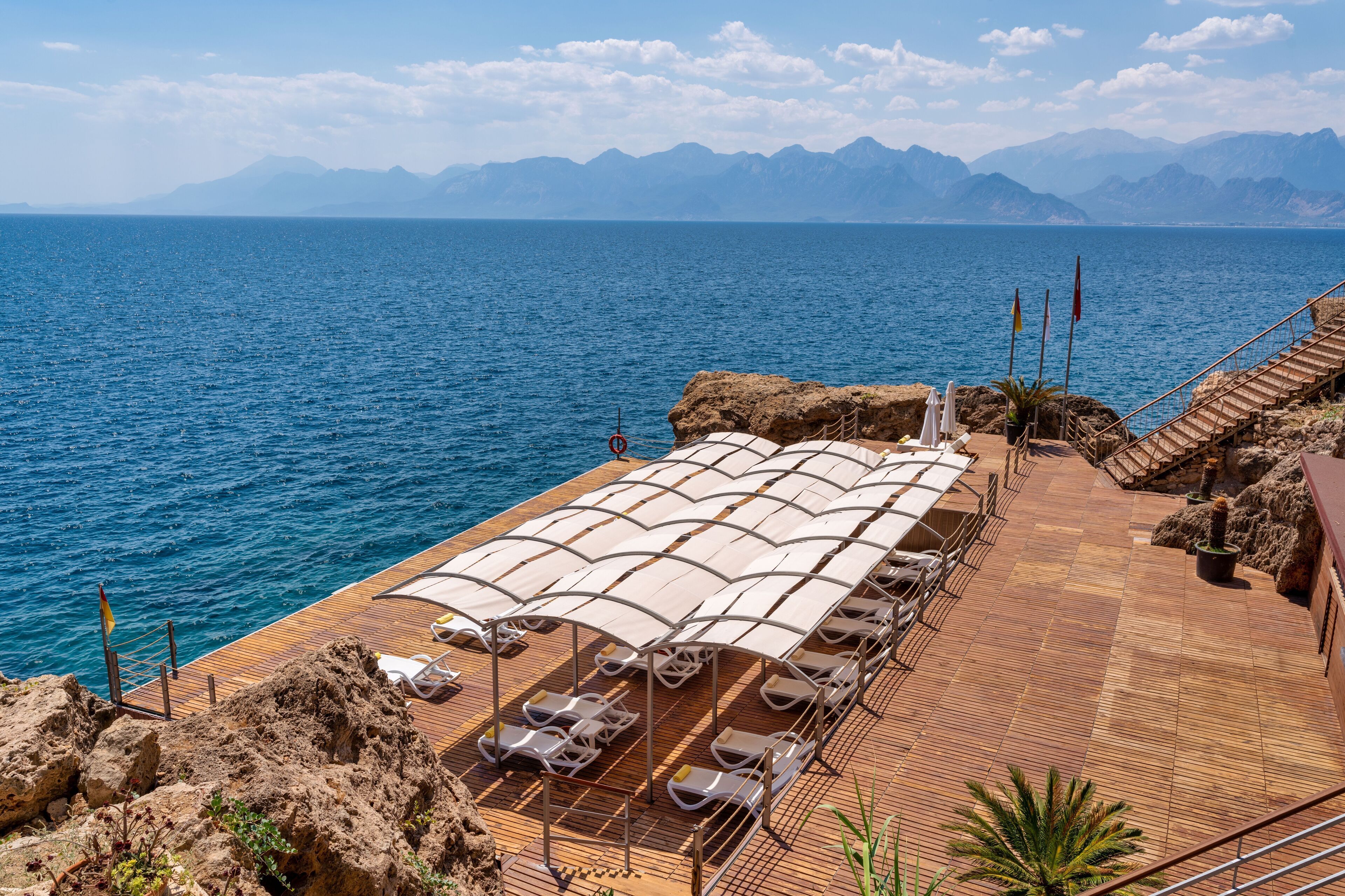Private beach, black sand, sun loungers, beach umbrellas