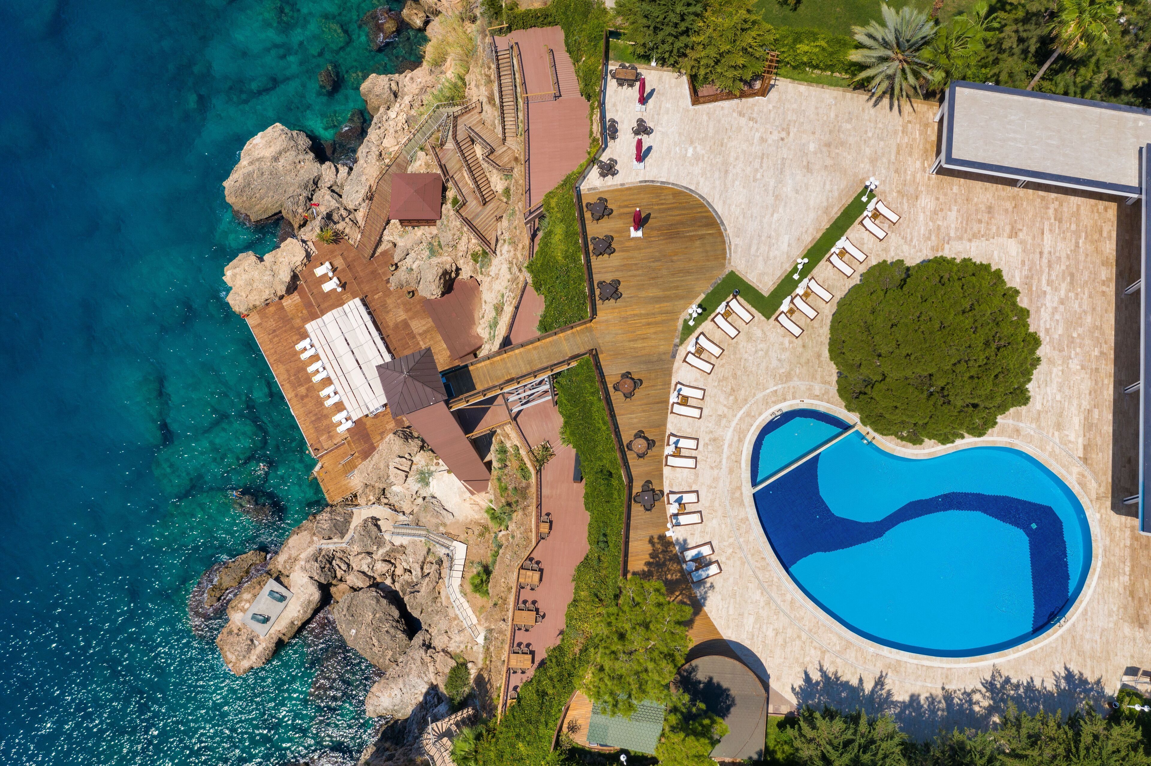 Indoor pool, seasonal outdoor pool, pool umbrellas, pool loungers