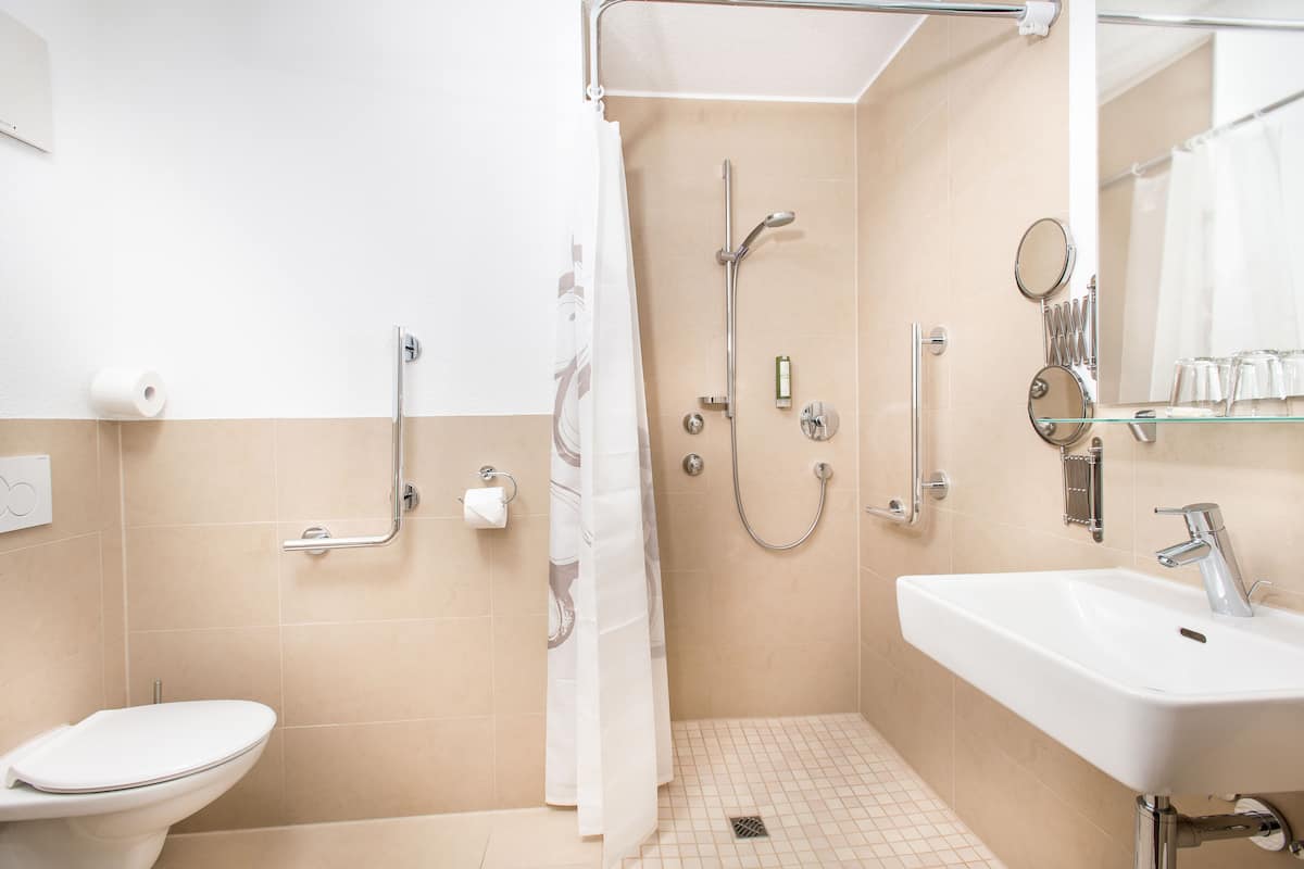 superior double room, 1 king bed, accessible, non smoking | bathroom amenities | shower, hair dryer, slippers, towels