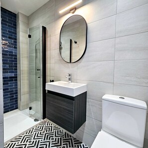 Twin Room | Bathroom | Shower, hair dryer, towels, soap