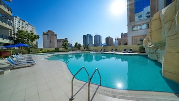 Outdoor pool, open 7:00 AM to 7:00 PM, pool umbrellas, pool loungers