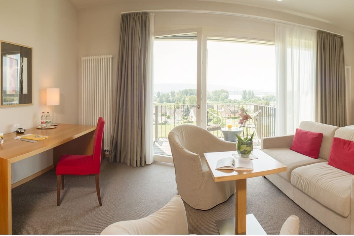 superior double room, balcony, lake view | premium bedding, in-room safe, desk, laptop workspace