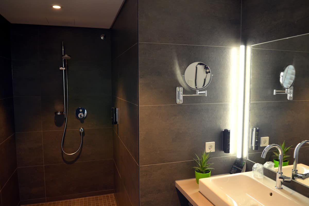 superior double room, balcony, lake view | bathroom | shower, free toiletries, hair dryer, bathrobes